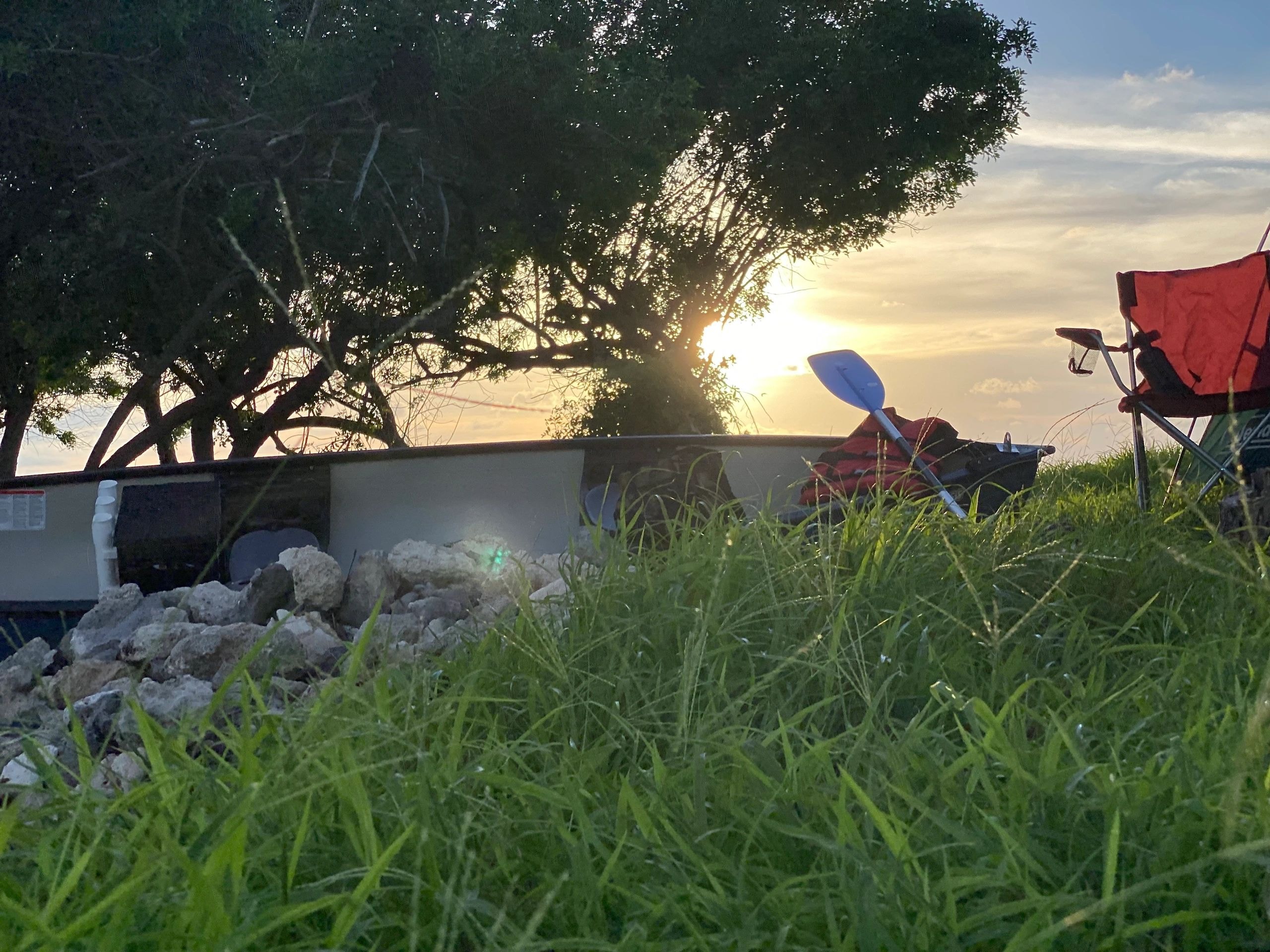 Camping by the lake at sunset
